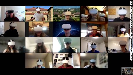 A screenshot of Stanford students participating in a discussion on Zoom while working together collaboratively as avatars in VR.