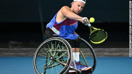 Dylan Alcott plays a backhand in his quad wheelchair singles final against Sam Schroder.
