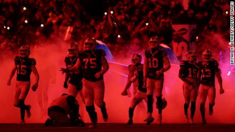 The Buffalo Bills run on the field prior to a game against the New England Patriots at Highmark Stadium on January 15, 2022, in Buffalo, New York. 