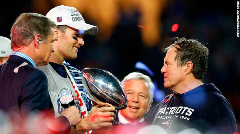 Brady, Kraft and Belichick celebrate with the Vince Lombardi Trophy after defeating the Seattle Seahawks to win Super Bowl XLIX on February 1, 2015.