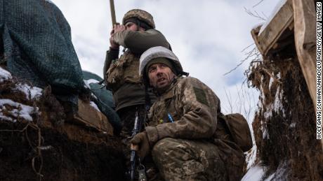 Ukrainian soldiers patrol on the frontline in Zolote, Ukraine, on January 20, 2022. 
