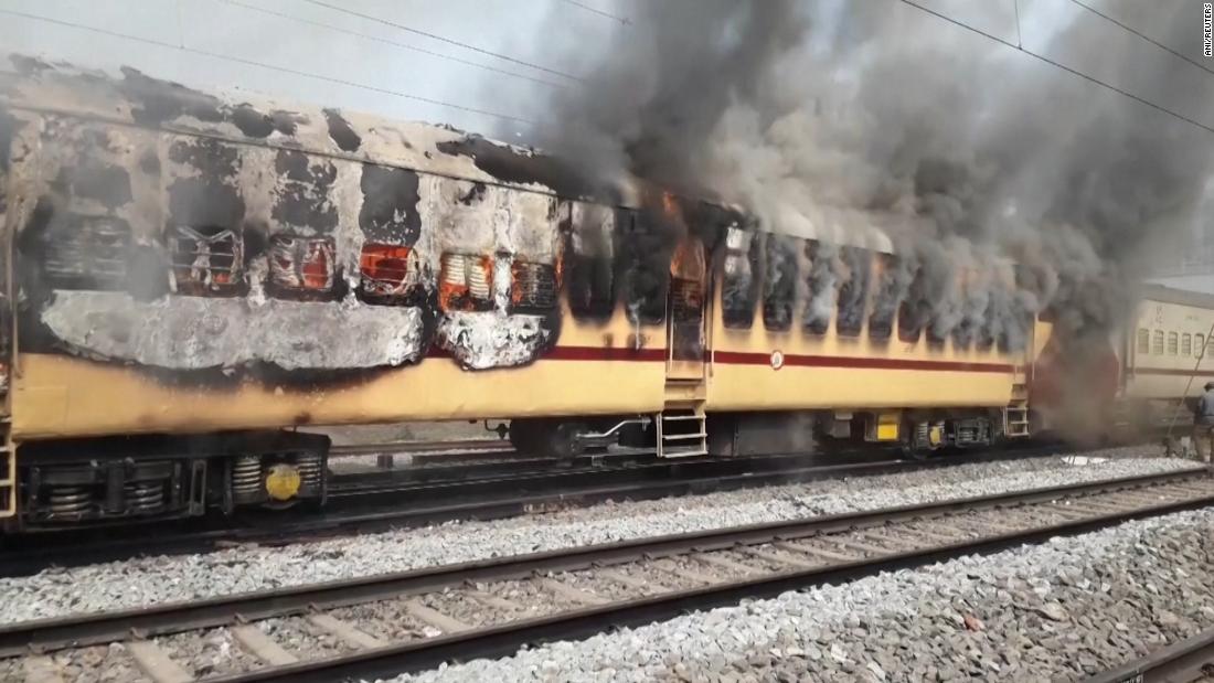 Train set ablaze in India as job-seekers protest