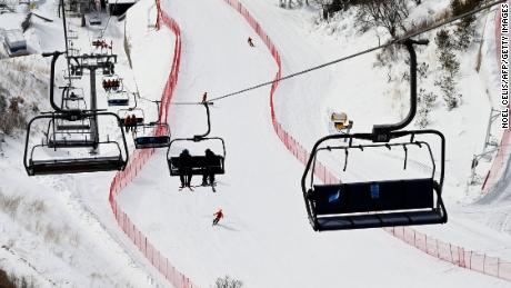 This picture taken on January 12, 2022 shows doctors riding on a lift at the National Alpine Ski Centre, a venue for the Beijing 2022 Winter Olympic Games, in Yanqing, on the outskirts of Beijing. - The world&#39;s finest skiers will start competing in the slalom, downhill and Super-G competitions in early February, and the doctors were putting in last minute practice at Yanqing, one of two sites north of China&#39;s capital that will host mountain-based events. - TO GO WITH Oly-2022-China-health-ski,FOCUS by Ludovic EHRET (Photo by NOEL CELIS / AFP) / TO GO WITH Oly-2022-China-health-ski,FOCUS by Ludovic EHRET (Photo by NOEL CELIS/AFP via Getty Images)