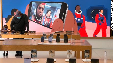New iPhone 13s are displayed at an Apple store on January 27, 2022 in Corte Madera, California. Apple reported record first-quarter earnings with $123.9 billion in overall revenue and $34.6 billion in profit. 