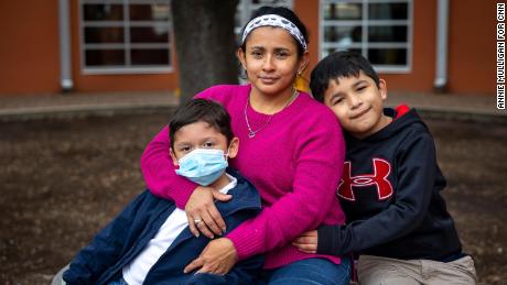 Diana Lopez, center, recently quit her job at a restaurant because she was afraid maskless coworkers could get her sick and put her sons Yeremy and Geovanny at risk.