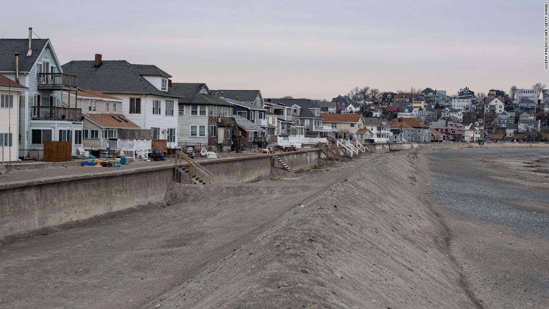 A sand brim wall is put up to protect beach homes from storm waves in Winthrop, Massachusetts on Friday, January 28.