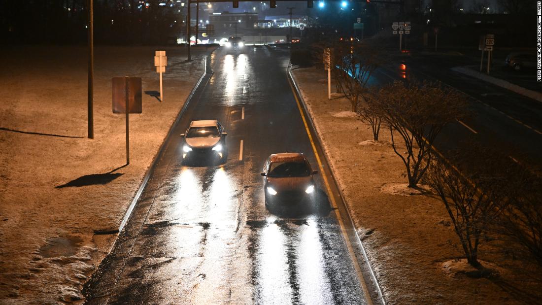 Snow falls in Charlotte, North Carolina, overnight on Friday. 