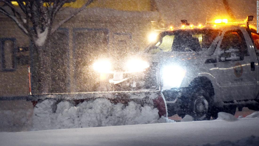 A snowplow clears streets in Rehoboth Beach, Delaware, early Saturday, January 29. 