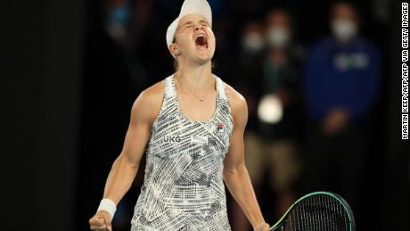 Australia&#39;s Ashleigh Barty celebrates after beating Danielle Collins.