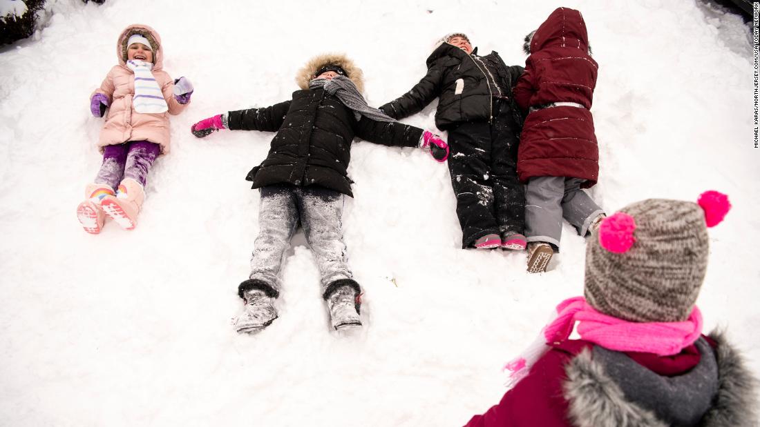 Children play in the snow in Clifton, New Jersey, on Saturday, January 29. 