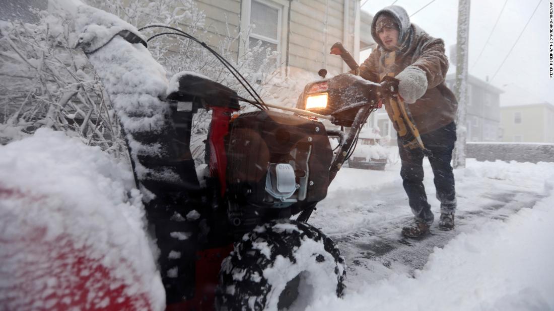 Patrick Lawrence clears his driveway of snow in New Bedford, Massachusetts, on Saturday, January 29. 