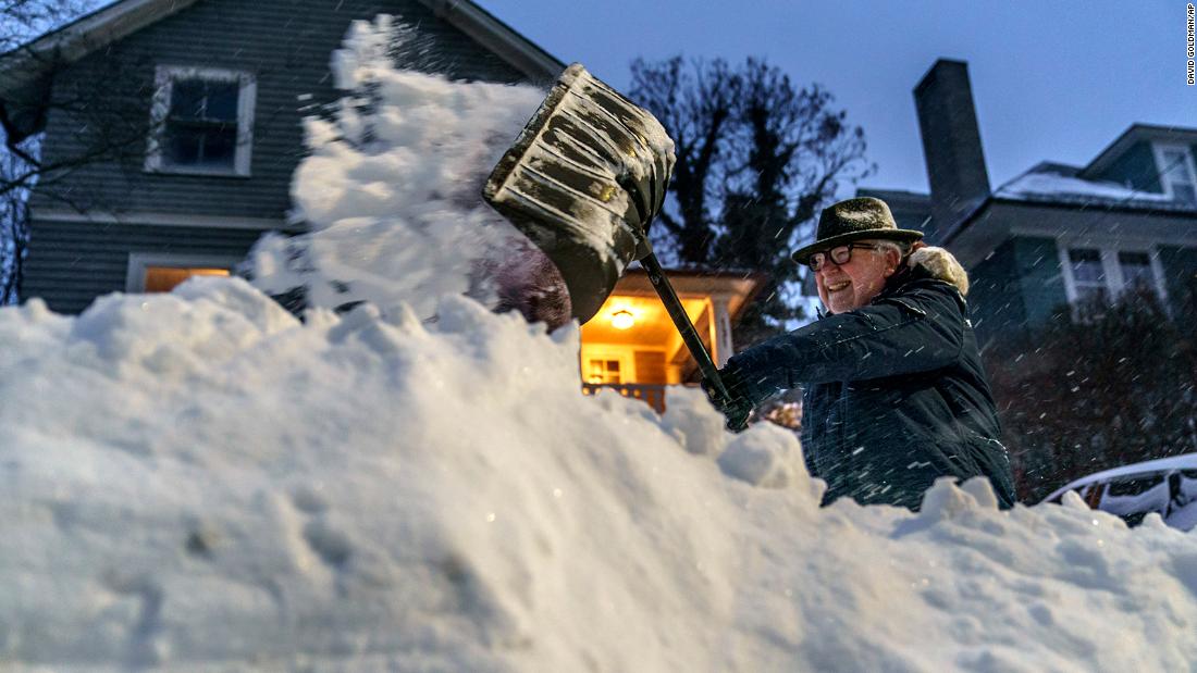 Mike Ratcliffe shovels snow from his driveway in Providence, Rhode Island, on Saturday.