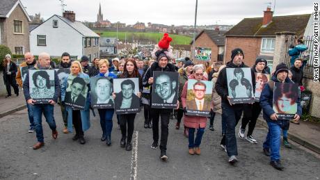 Family members carry photographs of those killed on Bloody Sunday at a memorial march in Londonderry (Derry), Northern Ireland, marking 50 years since the incident.