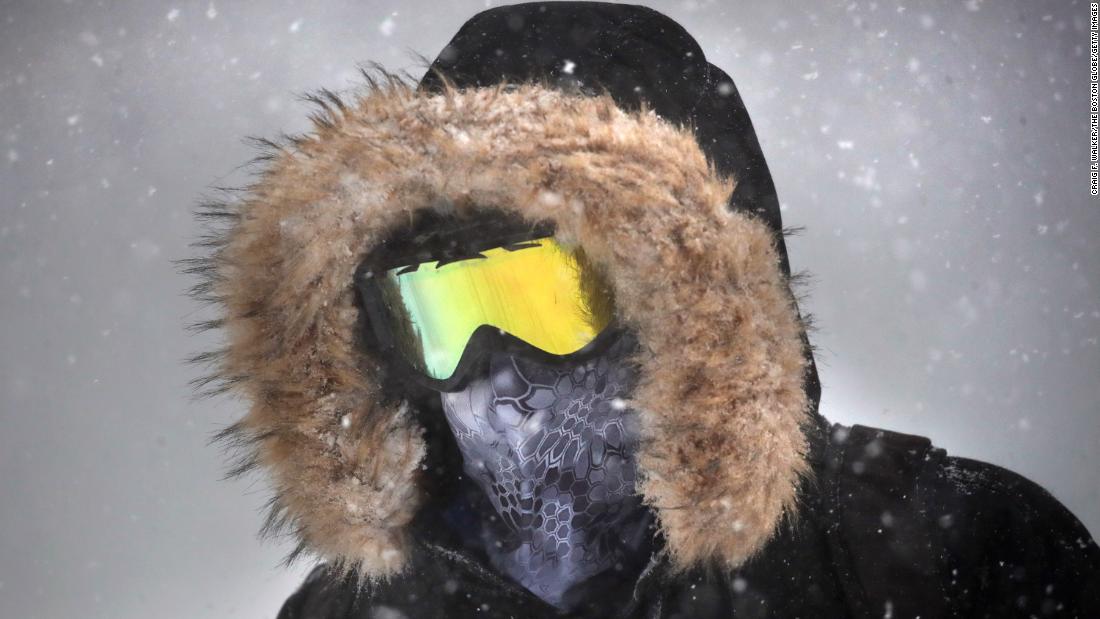 A person wears goggles while walking through the snow in downtown Boston, Massachusetts, on January 29.