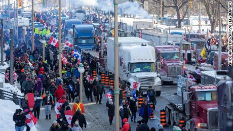 Hundreds of truckers drove their giant rigs into the Canadian capital Ottawa on Saturday as part of a self-titled & quot; Freedom Convoy & quot;  to protest vaccine mandates required to cross the US border. 