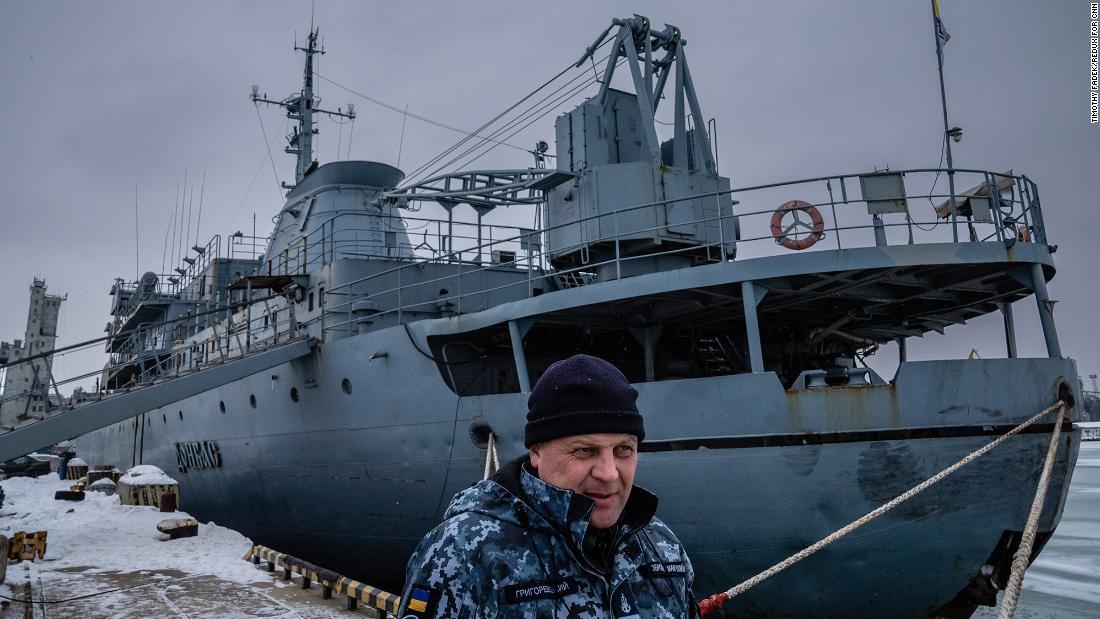 Ukrainian Navy Capt. Oleksandr Hrigorevskiy stands on the dock of Mariupol&#39;s port with his ship, the Donbas, behind him. &quot;I don&#39;t expect a war at sea with the Russians,&quot; he said.