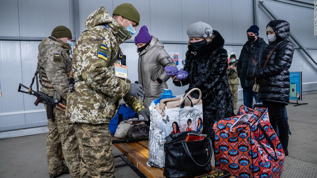 Ukrainians coming from the separatist-held territory stop at the Novotroitskoye checkpoint.