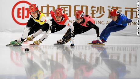China&#39;s Li Jinyu (2nd L), PyeongChang 2018 short track speed skating 1,500m silver medalist, competes during a short track speed skating test event for Beijing 2022 in April 2021.