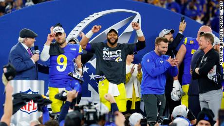 Stafford (left), Aaron Donald (middle) and McVay (right) react with the George Halas Trophy after defeating the San Francisco 49ers in the NFC Championship game.
