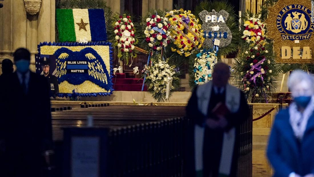 Flowers are displayed for Mora at St. Patrick&#39;s Cathedral.