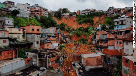 Firefighters search for survivors after heavy rains caused a landslide in Soa Paulo state, Brazil in January.
