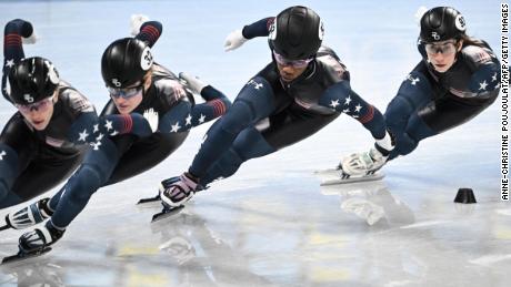 Members of the US short track speed skating team, including Biney (C) and Julie Letai (R), take part in a training session in Beijing.
