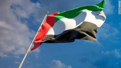 Beautiful national state flag of UAE Emirates with blank space. UAE Emirates flag on wide background with place for text 3D artwork.
