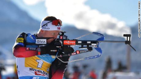 Johannes Thingnes Bø competes at the shooting range during the men&#39;s 4x7.5 km relay event of the IBU Biathlon World Cup in Hochfilzen, Austria, on December 12, 2021. 