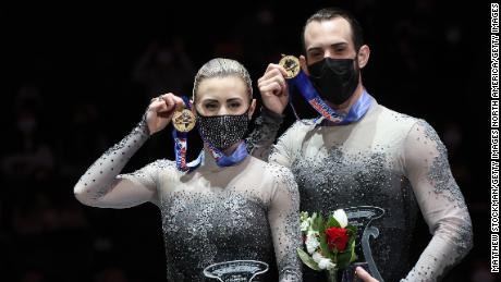 NASHVILLE, TENNESSEE - JANUARY 08: Ashley Cain-Gribble and Timothy LeDuc pose on the medals podium after winning the Pairs competition during the U.S. Figure Skating Championships at Bridgestone Arena on January 08, 2022 in Nashville, Tennessee. (Photo by Matthew Stockman/Getty Images)