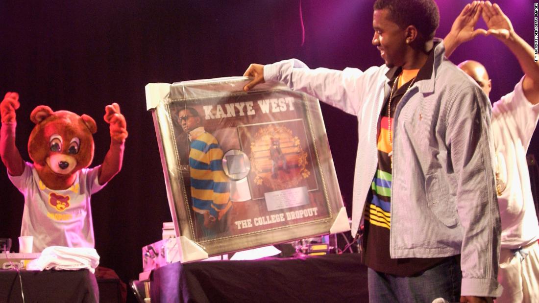 West is presented with his first platinum album for &quot;The College Dropout&quot; in 2004. The critically acclaimed album included hits such as &quot;Through the Wire,&quot; &quot;Jesus Walks&quot; and &quot;Slow Jamz.&quot; 