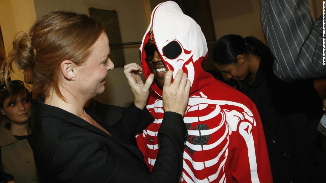 Designer Stella McCartney greets West as he attends her fashion show during Paris Fashion Week in 2006. 