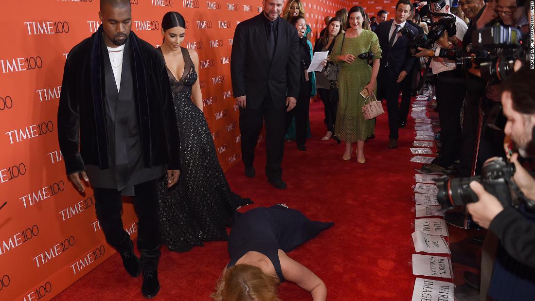 Comedian Amy Schumer pretends to &lt;a href=&quot;https://www.cnn.com/2015/04/22/entertainment/amy-schumer-moment-feat/index.html&quot; target=&quot;_blank&quot;&gt;trip and fall&lt;/a&gt; in front of West and Kardashian West as they attend the Time 100 Gala in 2015.