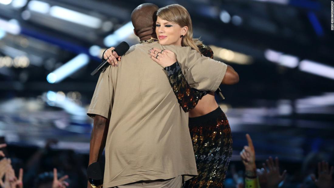 West embraces Swift after presenting him with the Michael Jackson Video Vanguard Award in 2015.