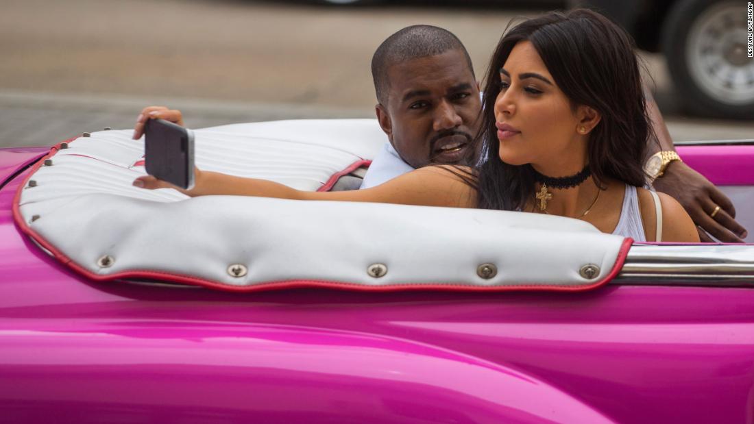 Kardashian West takes a selfie as she rides in a classic car with her husband in Havana, Cuba, in 2016. 