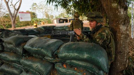 Colombian military forces guard a national highway in Arauca, Colombia on January 22, 2022. 