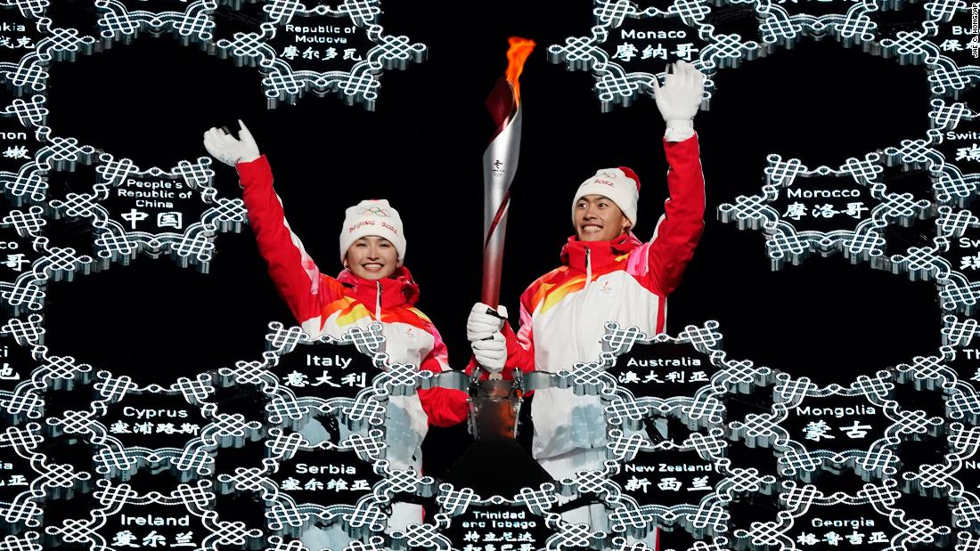 Chinese athletes Dinigeer Yilamujian, left, and Zhao Jiawen wave as they place the Olympic flame into a giant snowflake during the &lt;a href=&quot;http://www.cnn.com/2022/02/04/sport/gallery/opening-ceremony-beijing-winter-olympics/index.html&quot; target=&quot;_blank&quot;&gt;opening ceremony&lt;/a&gt; on February 4. The choice of Dinigeer and Zhao &lt;a href=&quot;https://edition.cnn.com/world/live-news/beijing-winter-olympics-2022-opening-ceremony-spt-intl-hnk/h_4474af75fecfed6a2f010181e818974c&quot; target=&quot;_blank&quot;&gt;appeared symbolic and deliberate.&lt;/a&gt; Dinigeer is a Uyghur, an ethnic minority in China&#39;s far west region of Xinjiang where China has been accused of massive human-rights violations. Zhao is of Han decent, the dominant ethnicity in China.