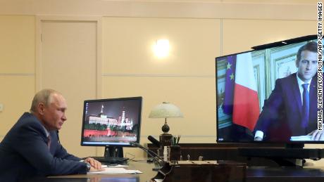 Russian President Vladimir Putin speaks with French President Emmanuel Macron during a video conference on June 26, 2020. 