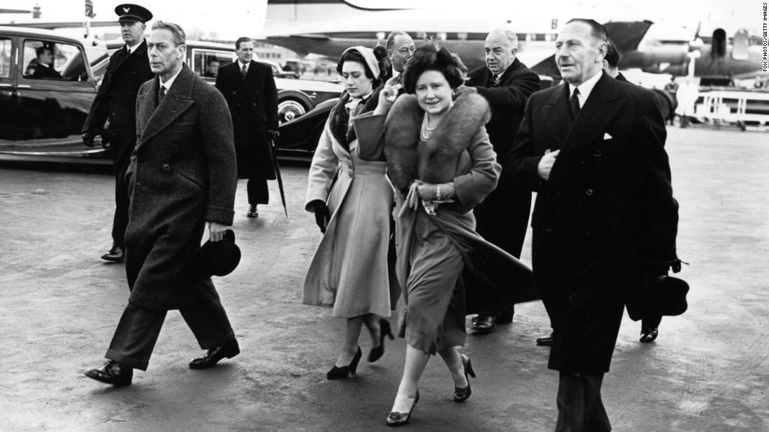 King George VI, left, is joined by his wife, Elizabeth, and Princess Margaret as he leaves an airport in London on January 31, 1952. They had waved farewell to Princess Elizabeth and her husband, Prince Philip, who were heading on a royal tour.