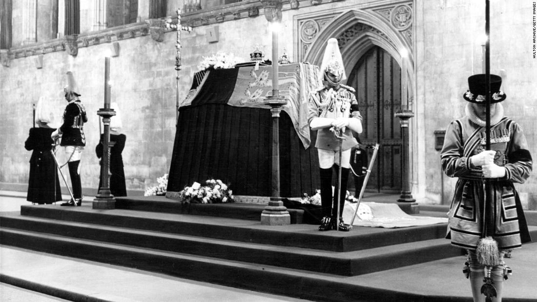King George&#39;s coffin is guarded at Westminster Hall in London.