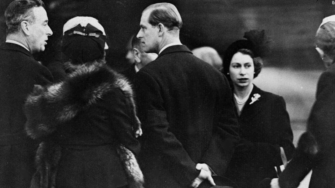 Elizabeth and Philip are greeted on their arrival in London.