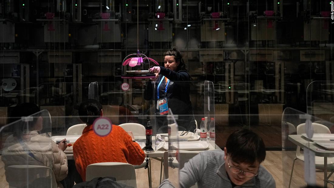 A robot delivers a woman&#39;s lunch in the media dining area on February 2. In a bid to keep the Games Covid-free — and to prevent the virus from spreading into the wider population — Chinese authorities constructed a &lt;a href=&quot;https://www.cnn.com/world/live-news/beijing-winter-olympics-02-05-22-spt-intl-hnk/h_47baaad9576326acec2ff83123cfc1f9&quot; target=&quot;_blank&quot;&gt;&quot;closed loop system&quot;&lt;/a&gt; that separated the Games from the host city.