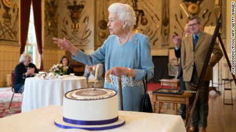 Guests gathered at the Queen's rural residence to celebrate her historic milestone with cake. 