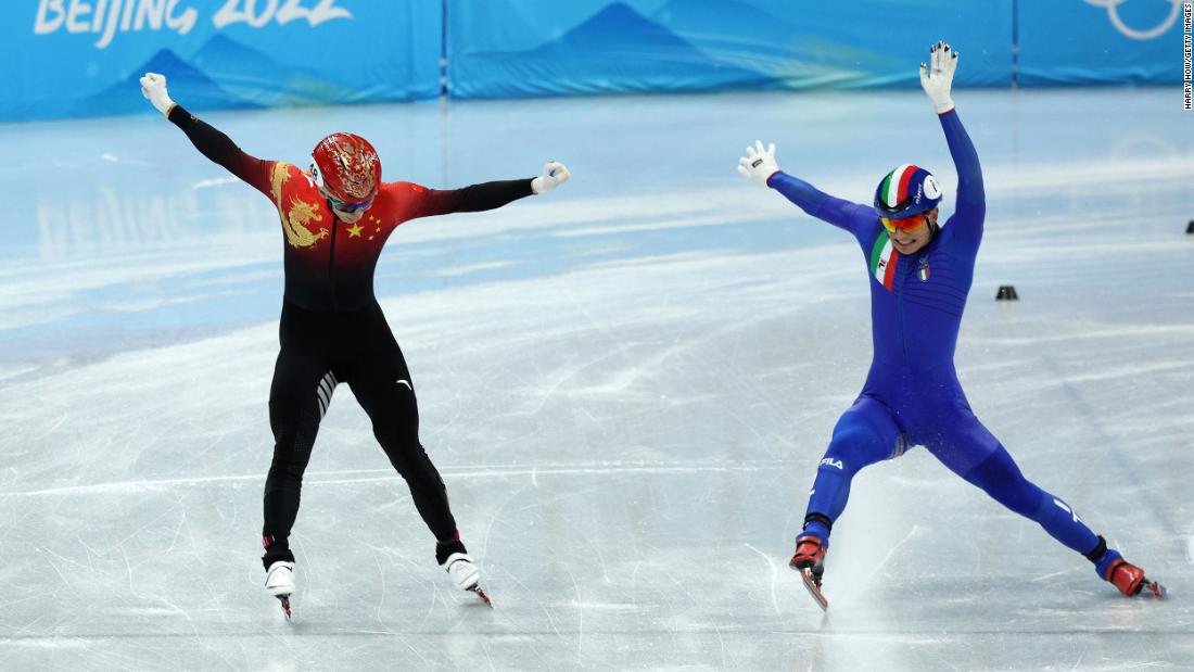 China&#39;s Wu Dajing, left, narrowly beats out Italy&#39;s Pietro Sighel to win the short track mixed relay on February 5. It was the host nation&#39;s first gold medal of these Games.