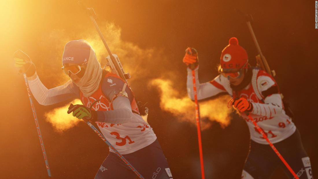 France&#39;s Anais Chevalier-Bouchet, left, skis during the biathlon mixed relay on February 5. France finished second behind Norway.