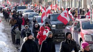Crowds of demonstrators join rallies across Canada as Covid-19 trucker protests spread