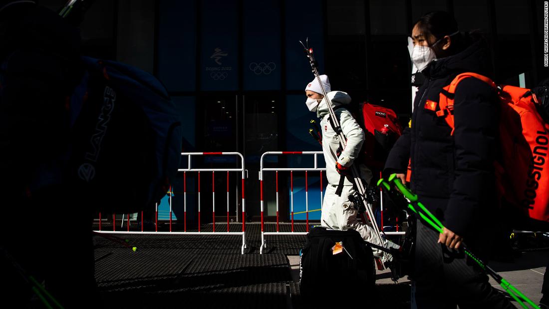 Skiers leave the Yanqing National Alpine Skiing Center after &lt;a href=&quot;https://www.cnn.com/world/live-news/beijing-winter-olympics-02-06-22-spt/h_1af54ca403dafee46143bcbde4525833&quot; target=&quot;_blank&quot;&gt;the men&#39;s downhill was postponed&lt;/a&gt; due to high winds on February 6.