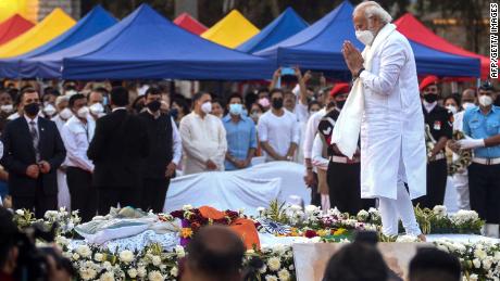 India&#39;s Prime Minister Narendra Modi (R) attends the state funeral ceremony of late Bollywood singer Lata Mangeshkar who died in Mumbai on February 6, 2022.