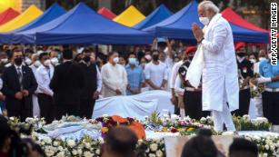 India&#39;s Prime Minister Narendra Modi (R) attends the state funeral ceremony of late Bollywood singer Lata Mangeshkar who died in Mumbai on February 6, 2022.
