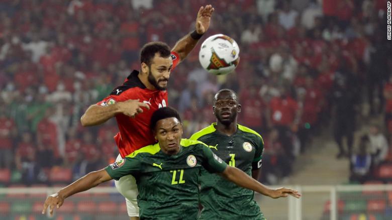 Egypt&#39;s Marwan Hamdi, top, jumps for the ball with Senegal&#39;s Abdou Diallo during the African Cup of Nations 2022 final soccer match on Sunday, February 6, 2022.