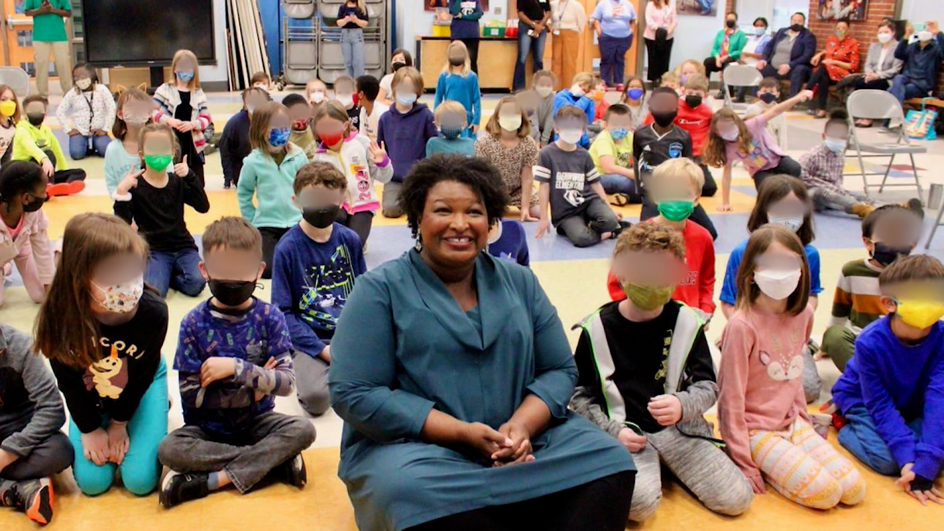 Stacey Abrams, unmasked in school classroom